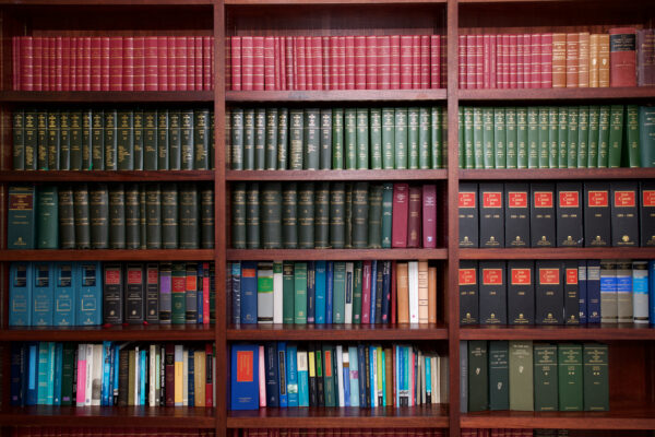 A bookshelf containing volumes of books about Irish Law.